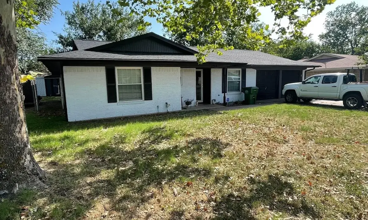 Professional roofing crew working on a residential roof in Herriman